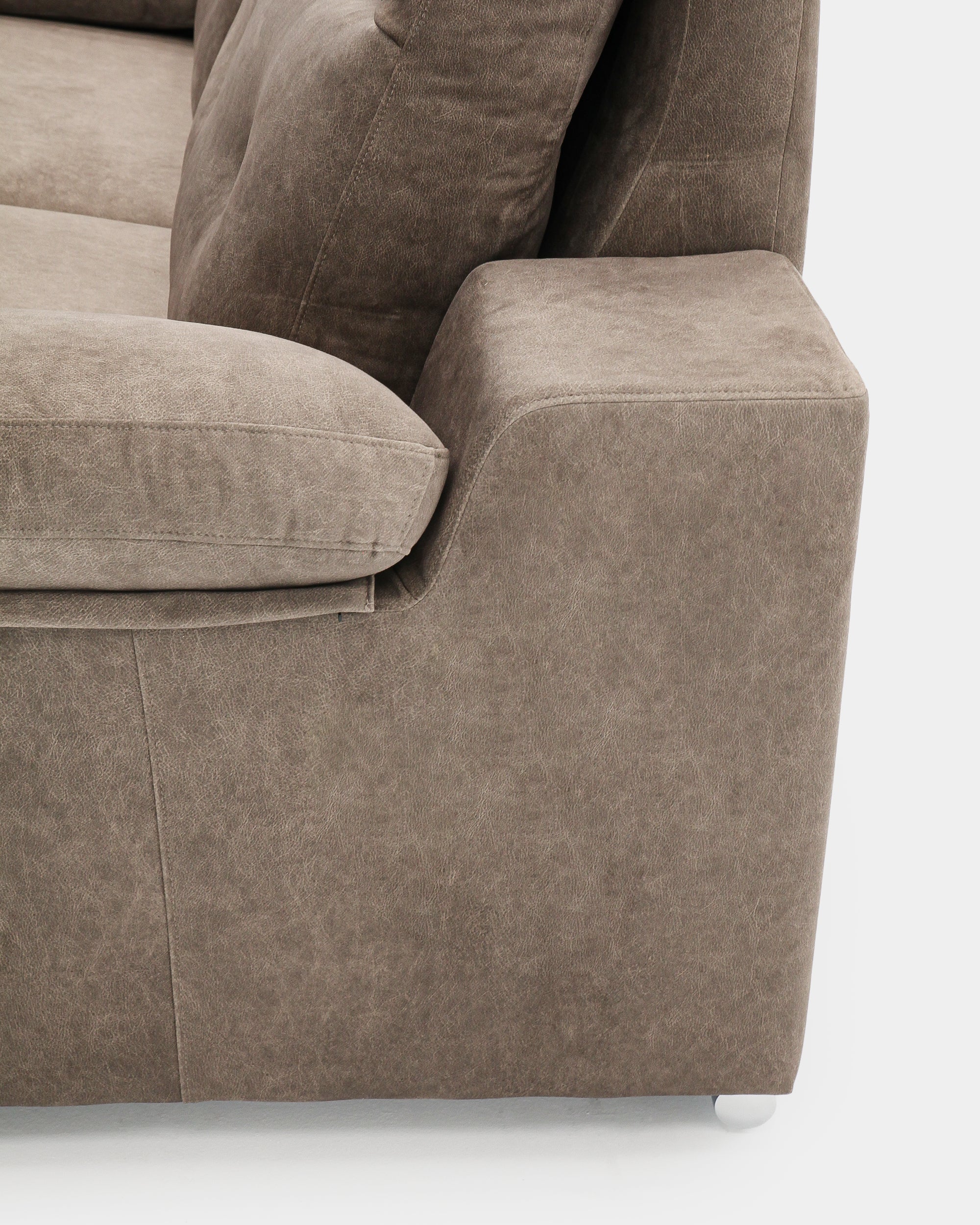 Comfortable three-seater brown sofa for modern living room