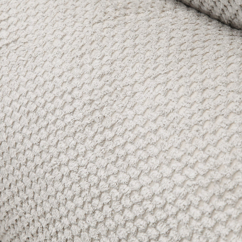 Sofá de tres plazas gris bicolor con texturas suaves