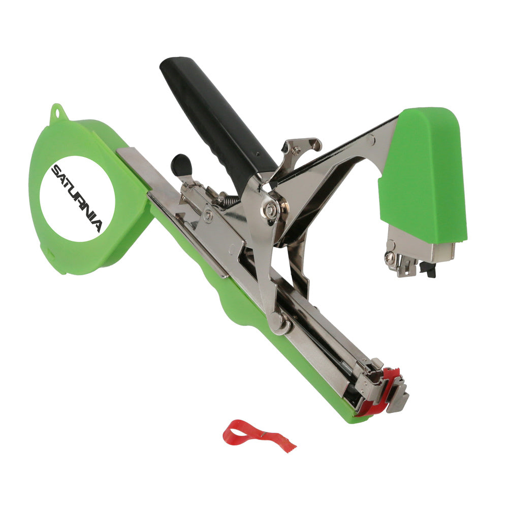 Agricultural tying machine for trellising with tape, staples, blade, and spring