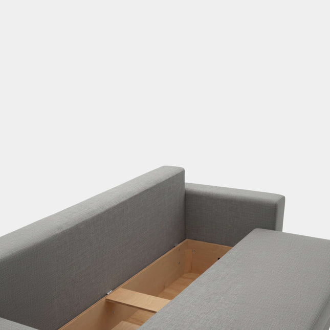 Sofá cama gris con apertura libro y almacenamiento