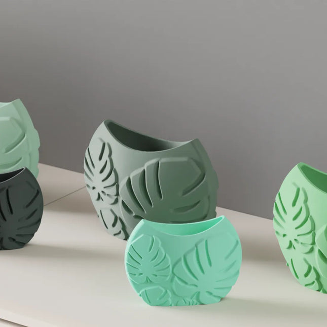 Jarrón decorativo con hojas tropicales en relieveJARRÓNHome & Garden > Decor > Vases