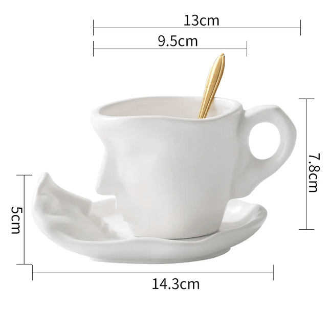 Tasse à café en céramique avec soucoupe et cuillère à visages abstraits