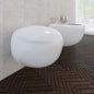 White ceramic wall-hung toilet and bidet