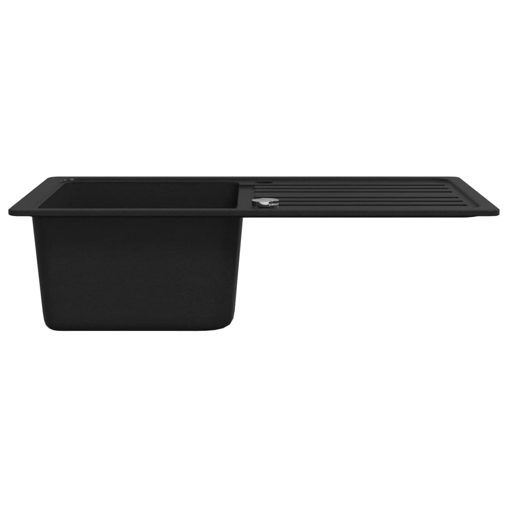 Fregadero de cocina de granito con un seno y escurridor negro