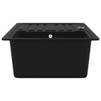 Fregadero de cocina de granito con un seno y escurridor negro