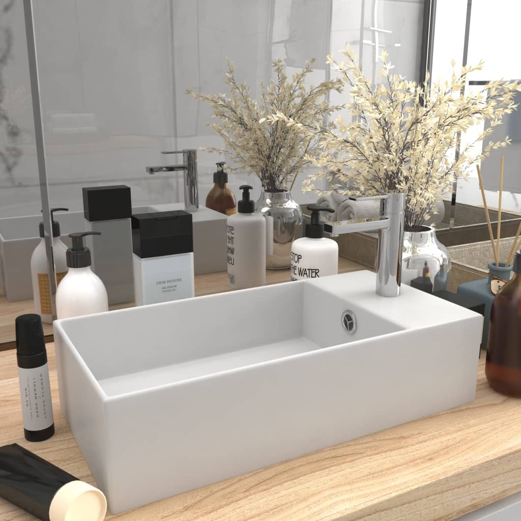 Light blue ceramic sink with overflow