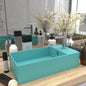 Light blue ceramic sink with overflow