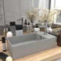 Light blue ceramic sink with overflow