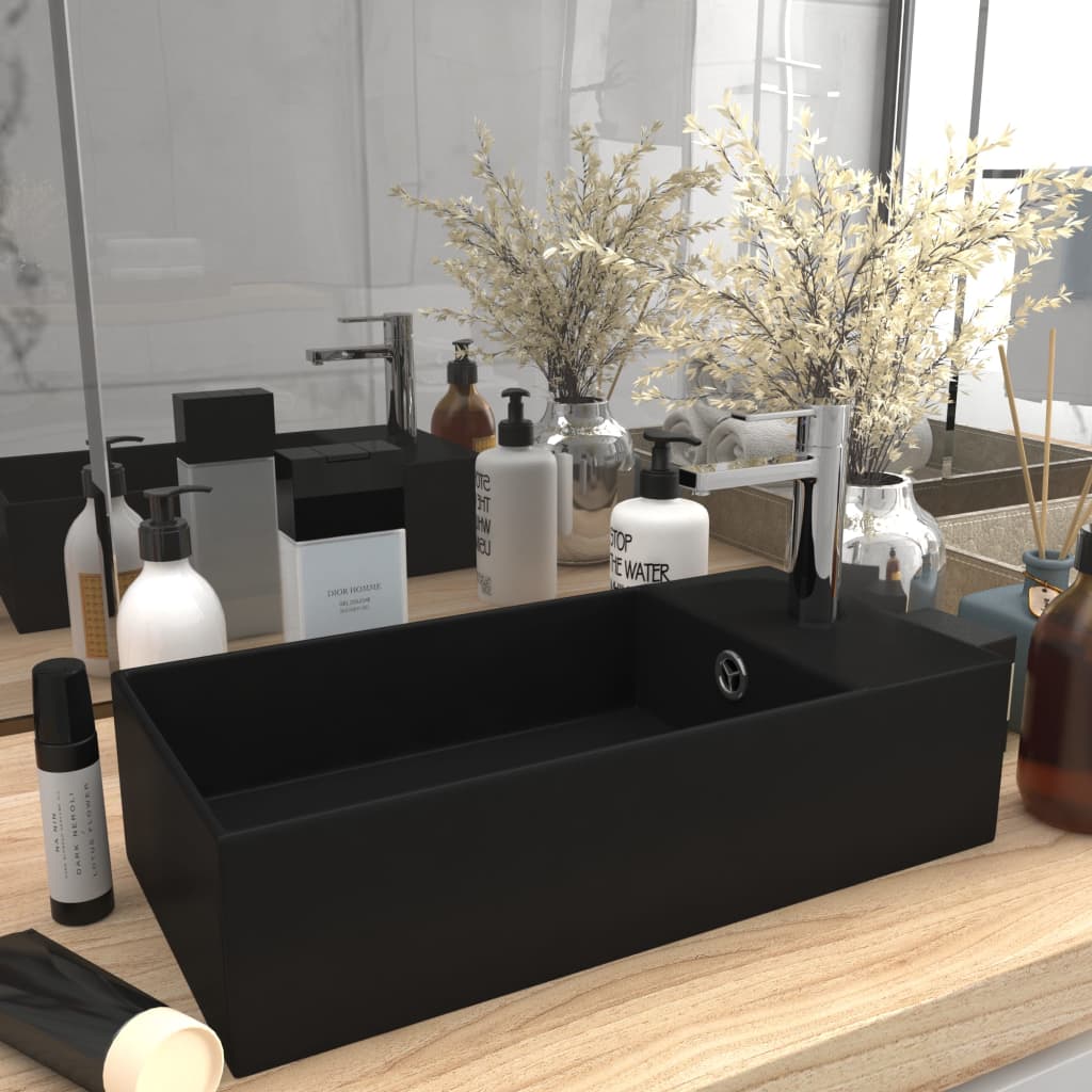 Light blue ceramic sink with overflow