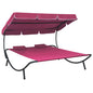 Outdoor lounge chair with canopy and cream-white cushions
