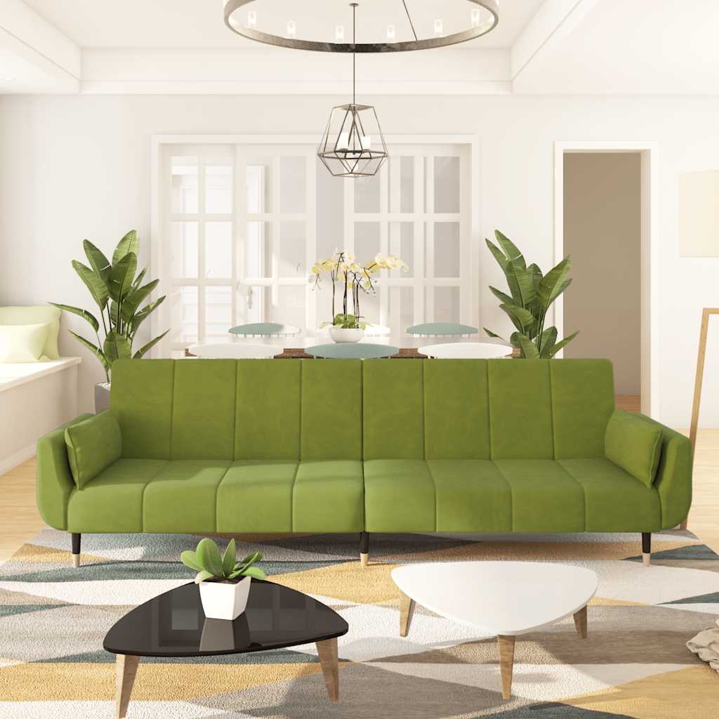 2-seater sofa bed with two burgundy velvet pillows
