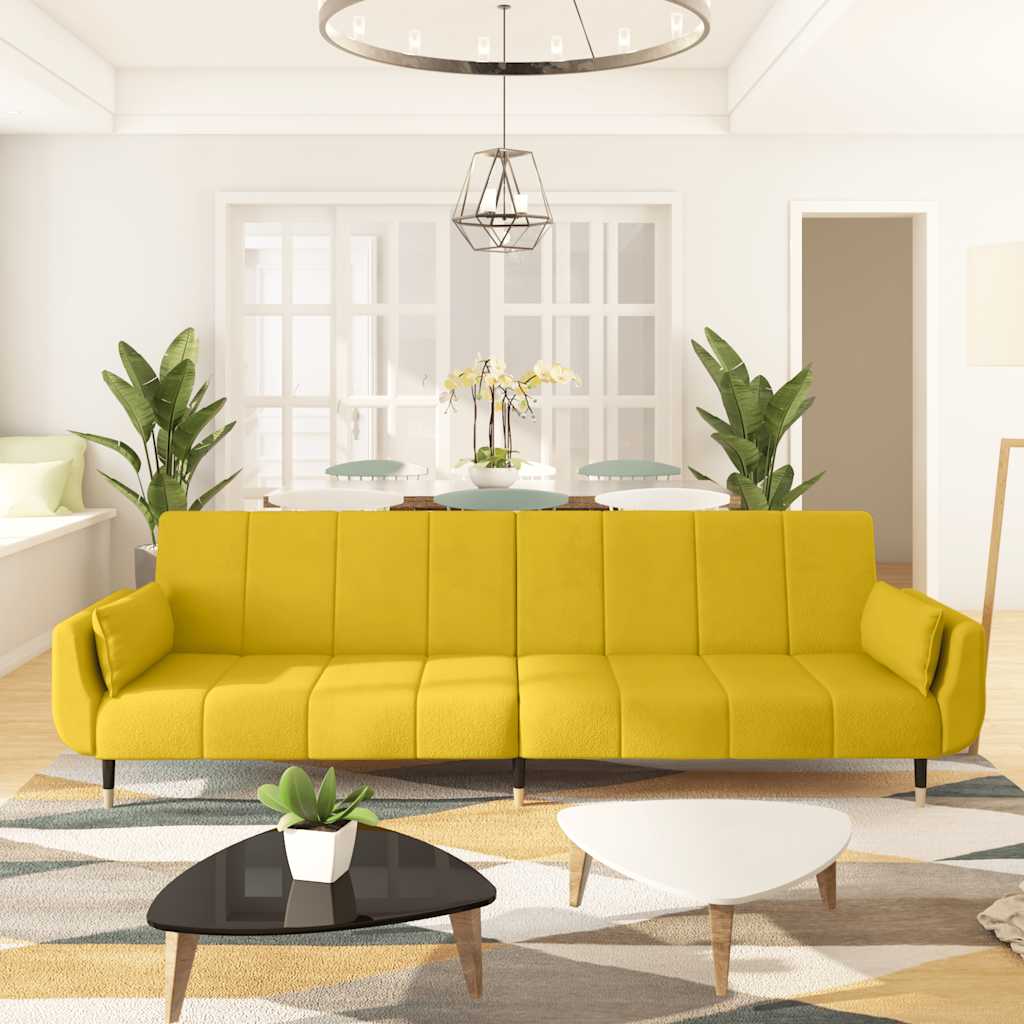 2-seater sofa bed with two burgundy velvet pillows