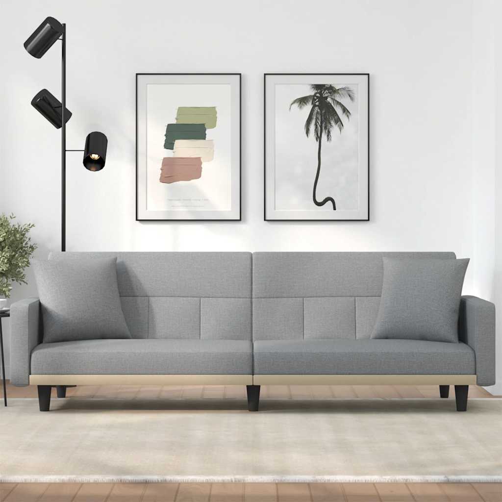 Sofa bed with light yellow fabric cushions
