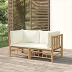 Sofás de esquina de jardín 2 uds bambú con cojines blanco crema