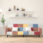 2-seater sofa bed with two blue fabric pillows