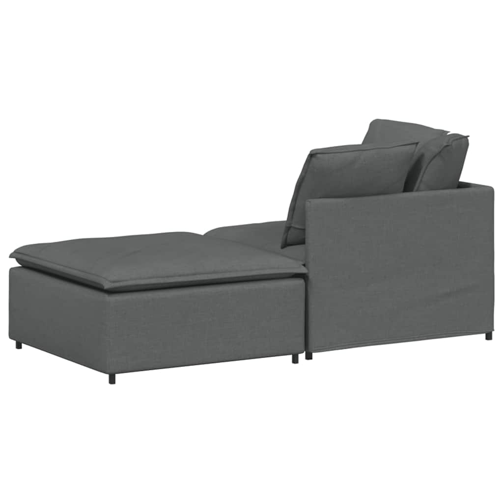 Sofá modular con reposapiés y cojines de tela gris oscuro
