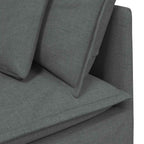 Sofá modular con reposapiés y cojines de tela gris oscuro