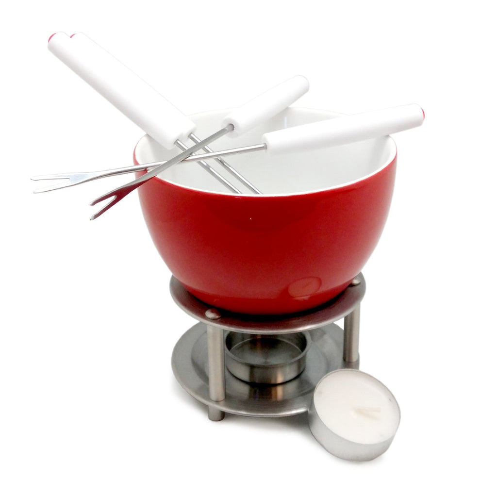 Ceramic fondue with skewers and candle