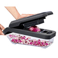Manual vegetable chopper with interchangeable blades