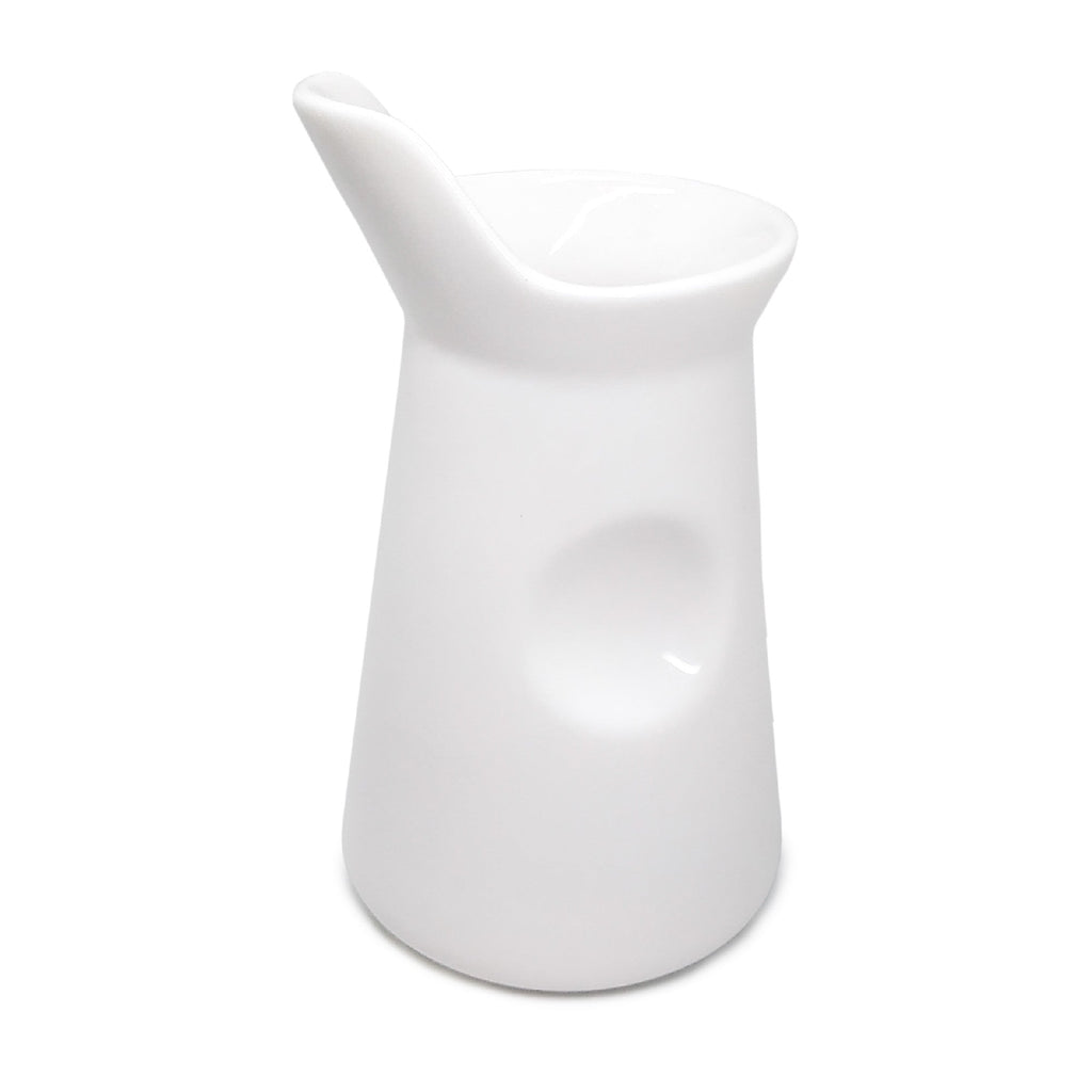 White porcelain milk jug for coffee or tea