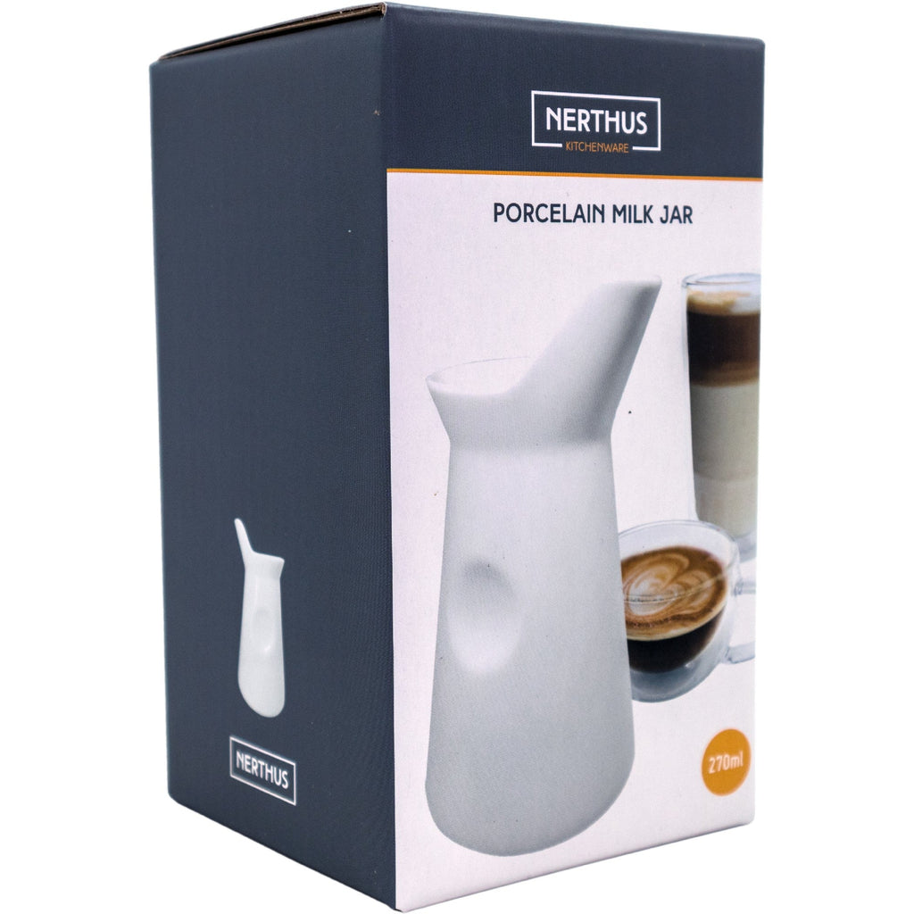 White porcelain milk jug for coffee or tea
