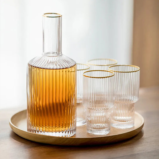 Useful and decorative transparent glass bottles with matching glass