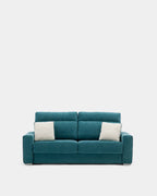 Blue pull-out sofa bed with cushions for guests
