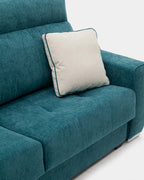 Blue pull-out sofa bed with cushions for guests