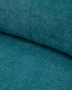 Blue pull-out sofa bed with cushions for guests