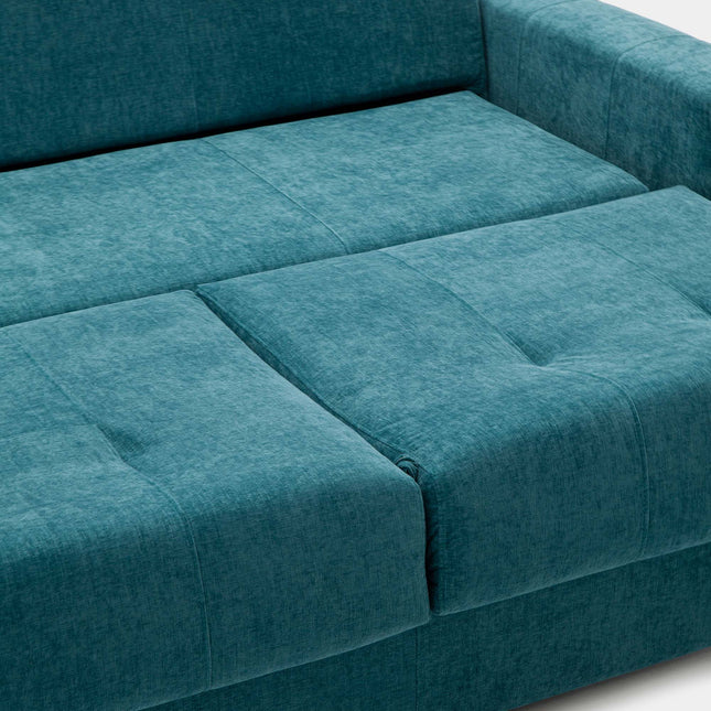 Sofá cama deslizante azul con cojines para visitas