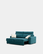 Blue pull-out sofa bed with cushions for guests
