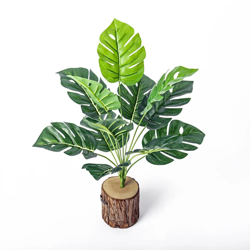 Planta artificial decorativa 43 cm | hojas tropicales realistas con base efecto troncoPlantas artificialesHome & Garden > Decor > Artificial Flora > Artificial Non-Flowering Plants