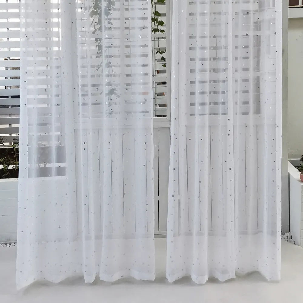 White sparkly tulle curtains with stars