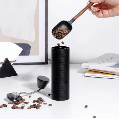 Portable hand coffee grinder with double bearing positioning