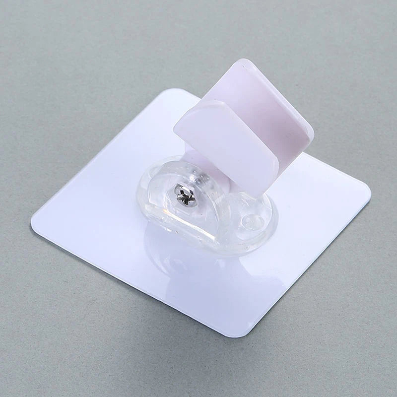 Soporte ajustable para cabezal de ducha autoadhesivoCabezales de ducha