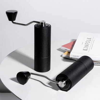 Portable hand coffee grinder with double bearing positioning