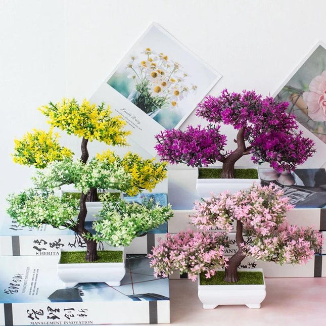 Pots with small artificial plants, table decoration