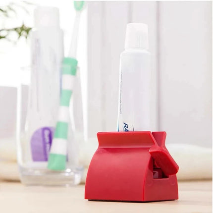 Toothpaste squeezer dispenser