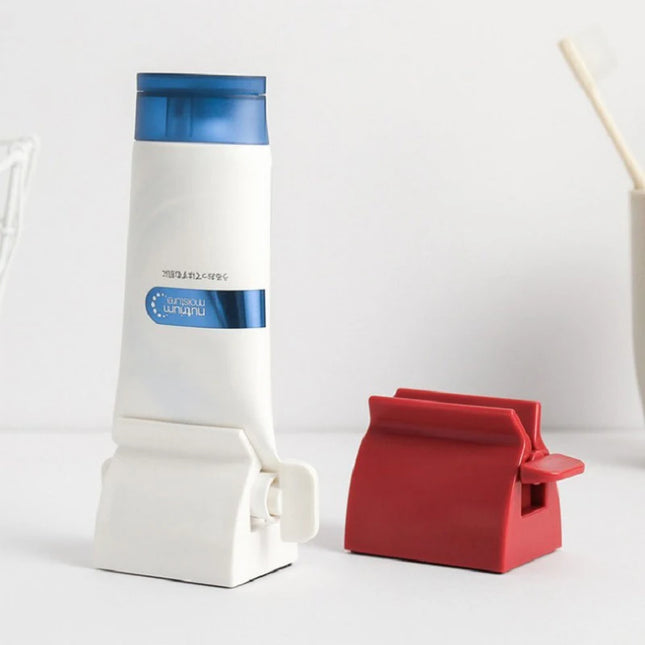 Toothpaste squeezer dispenser