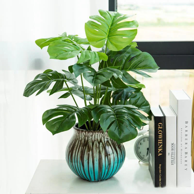 Planta artificial decorativa 43 cm | hojas tropicales realistas con base efecto troncoPlantas artificialesHome & Garden > Decor > Artificial Flora > Artificial Non-Flowering Plants