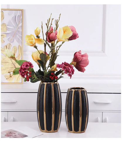 Modern black ceramic vases with gold stripes