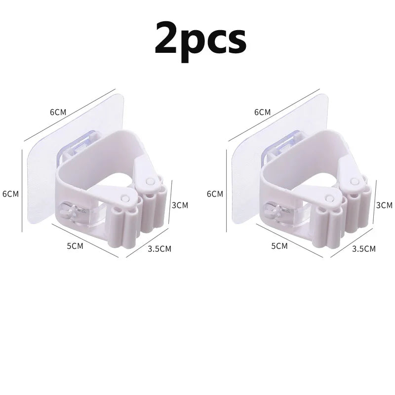 Soporte de pared de clip para escobas y fregonas autoadhesivosColgadores