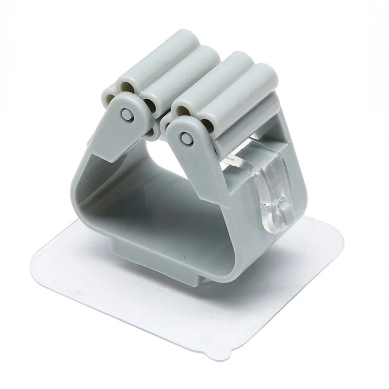 Soporte de pared de clip para escobas y fregonas autoadhesivosColgadores