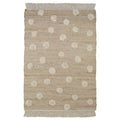 Jute and cotton rug with embossed polka dots and fringes