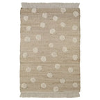 Jute and cotton rug with embossed polka dots and fringes