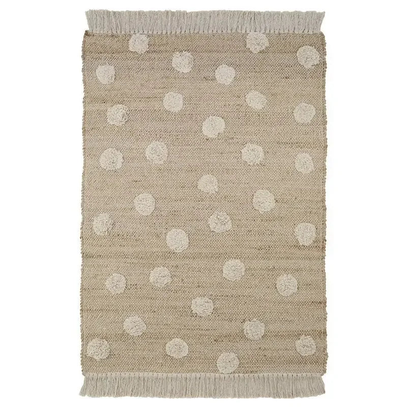 Jute and cotton rug with embossed polka dots and fringes