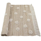 Jute and cotton rug with embossed polka dots and fringes