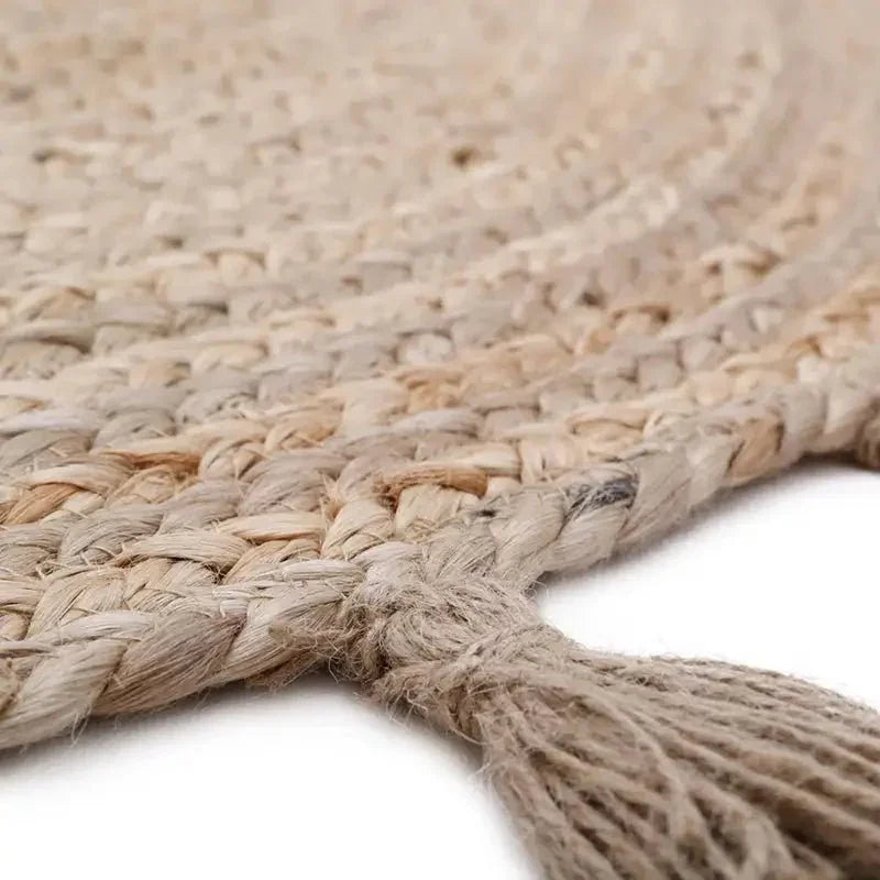 Round jute children's rug with pompoms