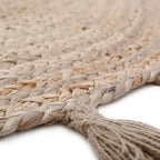 Round jute children's rug with pompoms