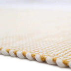 Hand-woven wool rug in a vibrant mango color